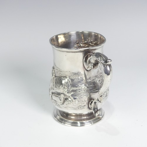 84 - A Victorian silver Half Pint Mug, hallmarked London, 1874, decorated in relief with agricultural she... 