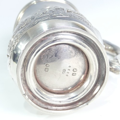 84 - A Victorian silver Half Pint Mug, hallmarked London, 1874, decorated in relief with agricultural she... 