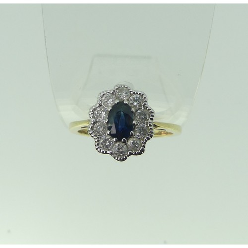 307 - A sapphire and diamond cluster Ring, the central oval facetted sapphire approx. 5.6x4.1mm, surrounde... 