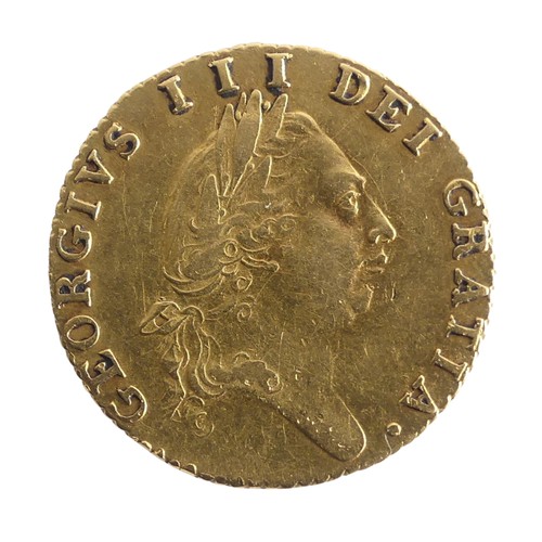 606 - A George III gold Half Guinea, dated 1787, the reverse with spade shaped coat of arms.Provenance; Th... 