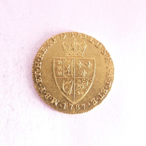 642 - A George III gold Guinea, dated 1787, with spade shaped shield reverse.Provenance; The Jeffery Willi... 