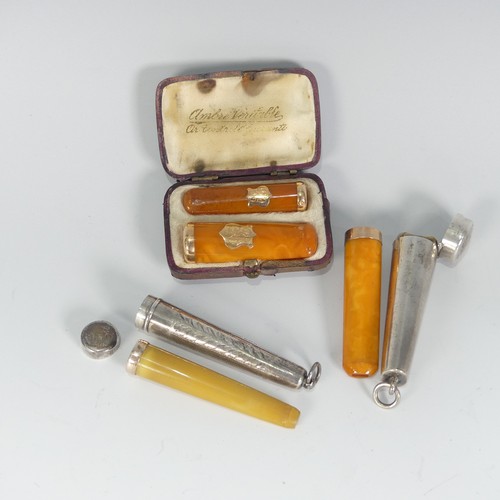 117 - A pair of early 20thC gold mounted amber Cheroot Holders, in fitted leather case, together with a la... 