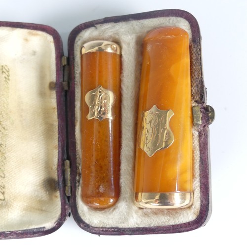 117 - A pair of early 20thC gold mounted amber Cheroot Holders, in fitted leather case, together with a la... 