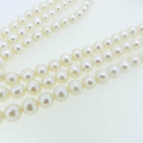 371 - A triple row cultured pearl choker Necklace, the uniform pearls each approx. 6.5-7mm diameter, on un... 