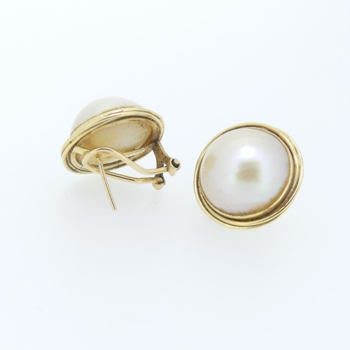 428 - A pair of Mabé Pearl Earrings, mounted in  14ct gold, 2cm overall diameter, pillar and clip fitting,... 