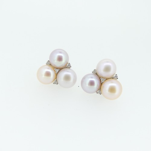 429 - A pair of cultured Pearl Earrings, formed of a trio of pearls, all with varying pink hues, with four... 