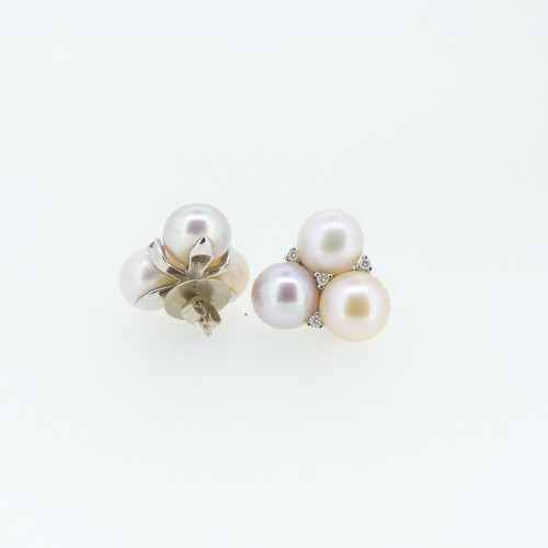 429 - A pair of cultured Pearl Earrings, formed of a trio of pearls, all with varying pink hues, with four... 