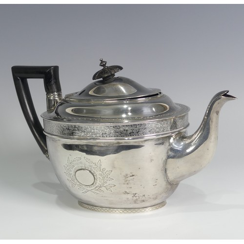 124 - A George III silver Teapot, hallmarked London, 1805, of oval form with bright cut decoration, wooden... 