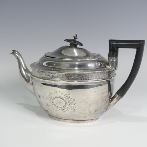 124 - A George III silver Teapot, hallmarked London, 1805, of oval form with bright cut decoration, wooden... 