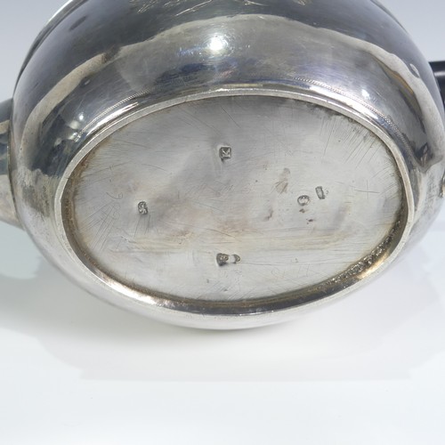 124 - A George III silver Teapot, hallmarked London, 1805, of oval form with bright cut decoration, wooden... 