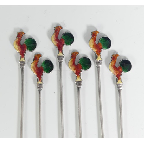 130 - A set of six Art Deco silver Cocktail Sticks, each with enamelled cockerel finials, marked 'Silver',... 