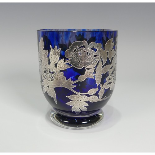 133 - A contemporary glass Vase, by Laugharne, of goblet form with circular foot, the mottled cobalt blue ... 