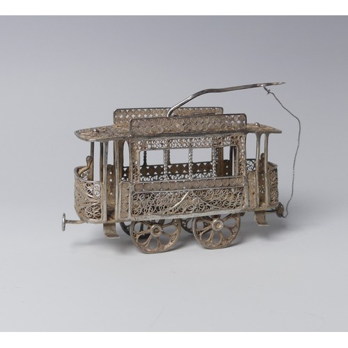 135 - An early 20th century silver filigree miniature model of a Tram, with four wheels and pantograph, 9c... 