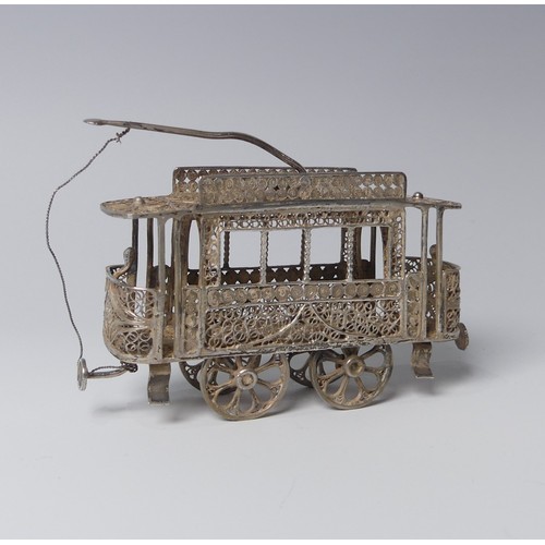 135 - An early 20th century silver filigree miniature model of a Tram, with four wheels and pantograph, 9c... 