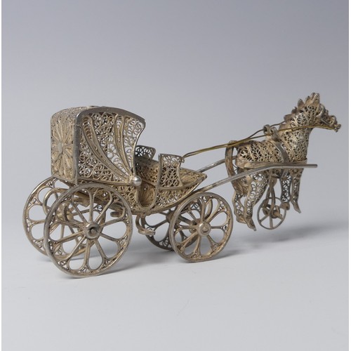 135 - An early 20th century silver filigree miniature model of a Tram, with four wheels and pantograph, 9c... 