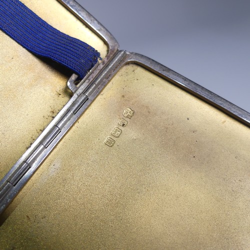 138 - A George VI silver cigarette case, hallmarked Chester, 1941, with engine turned decoration and inter... 