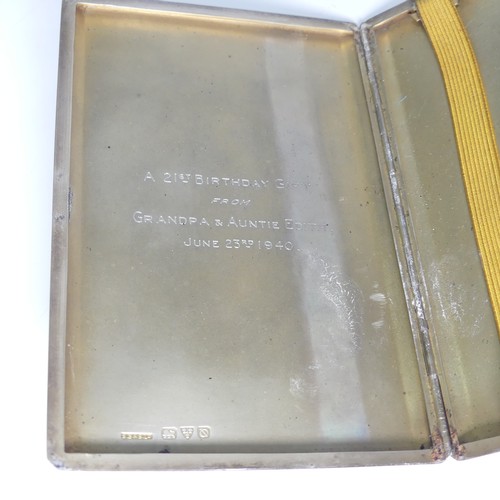 138 - A George VI silver cigarette case, hallmarked Chester, 1941, with engine turned decoration and inter... 