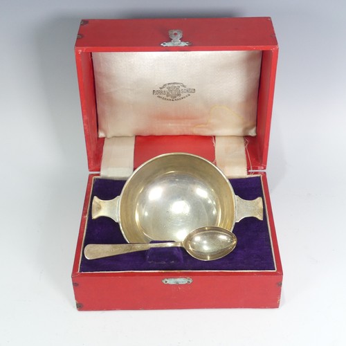 141 - A cased early 20thC Anglo - Indian silver Bowl and Spoon, by S. Orr & Sons, the two handled quai... 