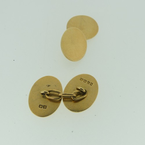 493 - A pair of 18ct yellow gold oval Cufflinks, both sides plain, 15.2g.