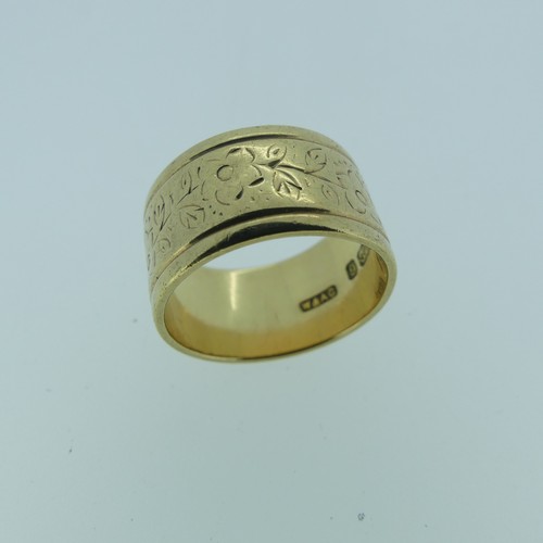 324 - A wide 9ct gold gold Band, with foliate decoration, Size L, 5.9g.