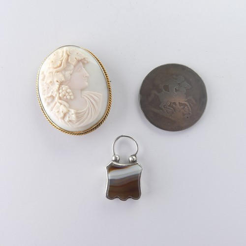 497 - A 9ct gold mounted oval shell Cameo, with ropetwist border, 5cm long, together with an unmarked silv... 