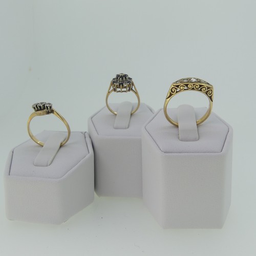 328 - A small graduated five stone diamond Ring, in boat shaped mount with scroll gallery, all in 9ct gold... 