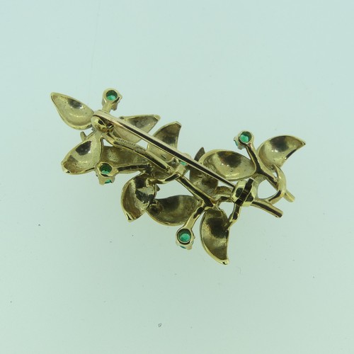 432 - A 9ct yellow gold foliate Brooch, set with five small circular emeralds, 4.5cm long, approx total we... 