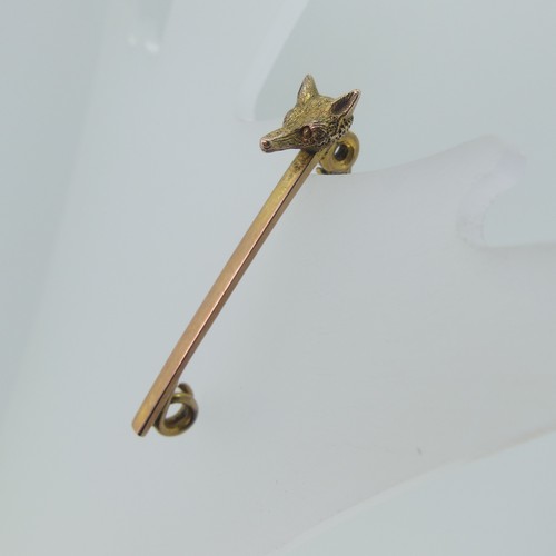 434 - A 9ct yellow gold Bow Brooch, 3.5cm long, together with a 9ct gold bar brooch with fox mask at one e... 