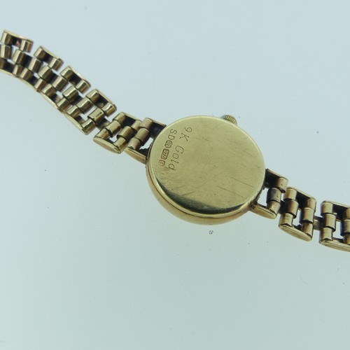 245 - A 9ct gold lady's Rotary Wristwatch, on 9ct gold bracelet strap, gross total weight 12.7g.... 