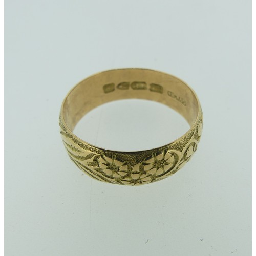 330 - An 18ct yellow gold Band, with foliate decoration, hallmarked Chester 1902, Size V½, 6.2g.... 