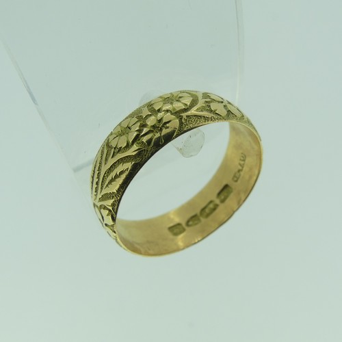 330 - An 18ct yellow gold Band, with foliate decoration, hallmarked Chester 1902, Size V½, 6.2g.... 