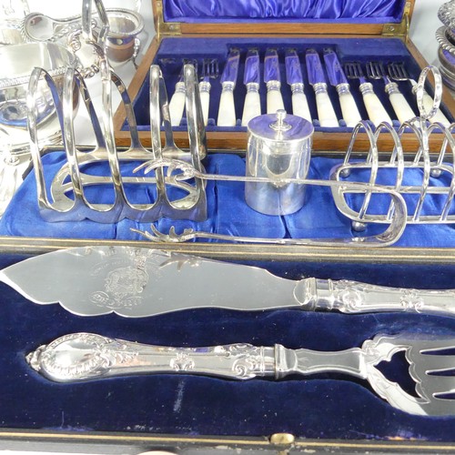 159 - A quantity of Silver Plate, including a pair of bottle coasters, toast racks, sauce boats, flatware ... 