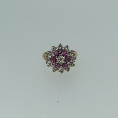 337 - A ruby and diamond cluster Dress Ring, all mounted in unmarked yellow and white gold, tested as 9ct,... 