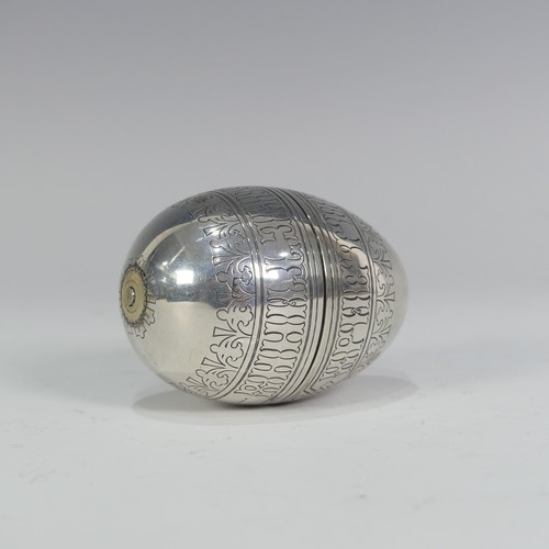 167 - A Russian silver Travelling Egg Cup, in the form of an egg that pulls apart with each half having a ... 