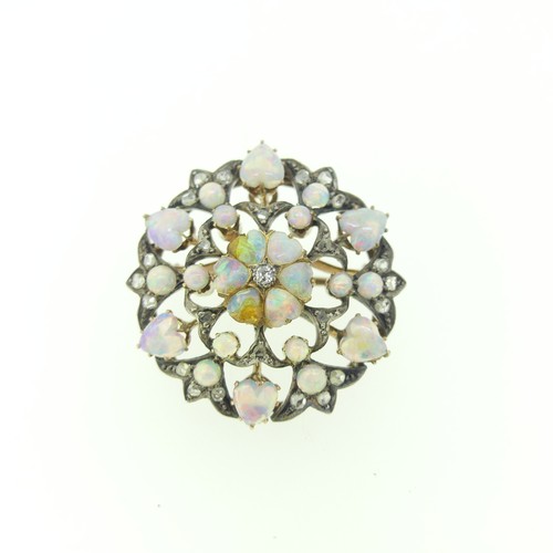 439 - A antique opal and diamond Pendant / Brooch, of open circular form, the centre with five heart shape... 