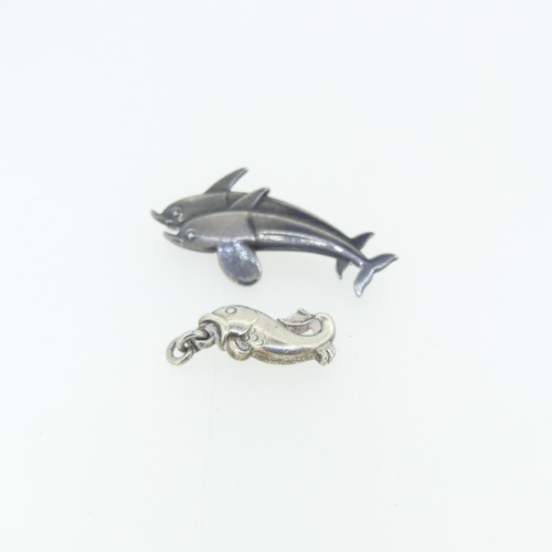 442 - Georg Jensen; A silver double Dolphin Brooch, design no. 317, 4cm long, together with a small Jensen... 