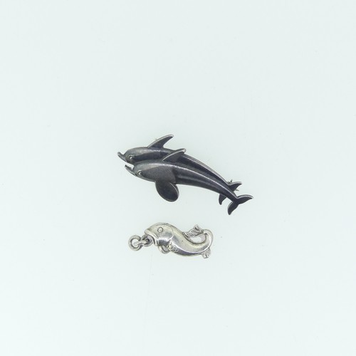 442 - Georg Jensen; A silver double Dolphin Brooch, design no. 317, 4cm long, together with a small Jensen... 