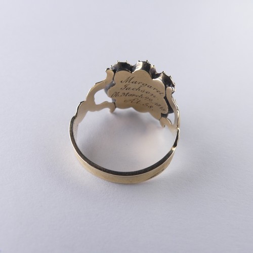 340 - An early 19thC Mourning Ring, with central hairset box and glass surrounded by eight facetted circul... 