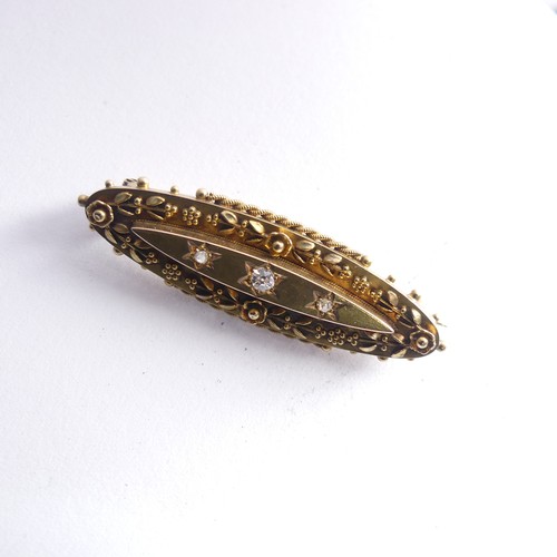 443 - A Victorian 15ct gold Brooch, the centre gypsy set with three diamonds, 4.3cm long, 4.7g.... 