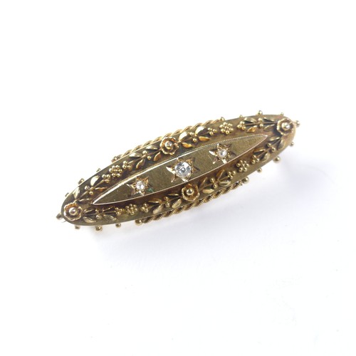 443 - A Victorian 15ct gold Brooch, the centre gypsy set with three diamonds, 4.3cm long, 4.7g.... 