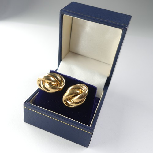 444 - A pair of 9ct yellow gold knot Earrings 2.3g, together with a pair of 18ct hollow oval earrings, set... 