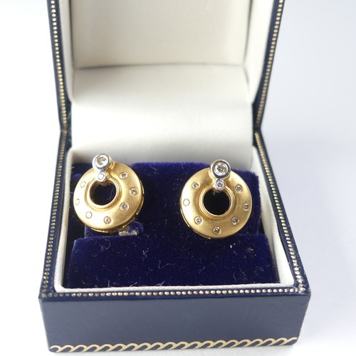 446 - A pair of 18ct yellow gold and diamond Earrings, of open circular form in brushed gold, two collet s... 