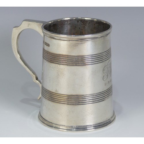 187 - A George V silver Mug, by Mappin & Webb Ltd., hallmarked Sheffield, 1917, tapering with bands of... 