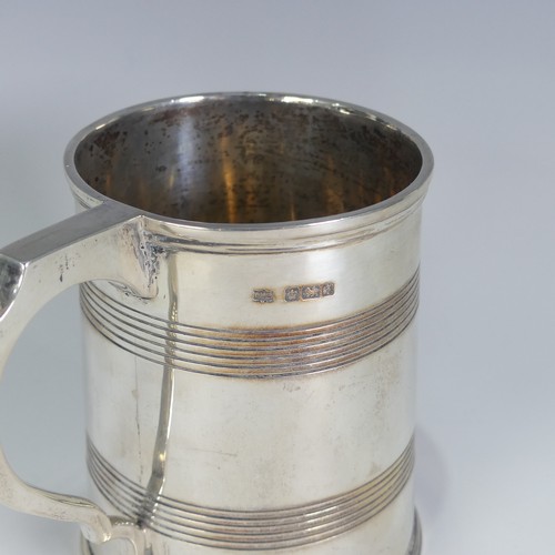 187 - A George V silver Mug, by Mappin & Webb Ltd., hallmarked Sheffield, 1917, tapering with bands of... 