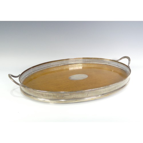 203 - An Edwardian silver mounted oak two handled Tray, by John Grinsell & Sons, hallmarked London 190... 