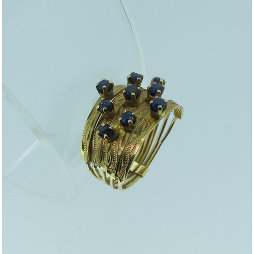 347 - An 18ct yellow gold multi strand Ring, the front claw set with nine small sapphires, Size M, approx.... 