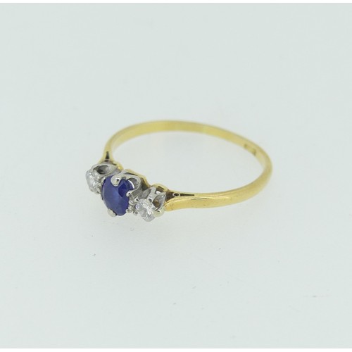 282 - A sapphire and diamond three stone Ring, the central oval facetted sapphire approx 4x4.6mm, with a c... 