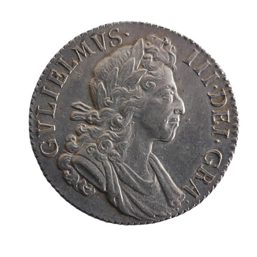 565 - A William III Shilling, dated 1700, good v/f.Provenance; The Jeffery William John Dodman Collection ... 