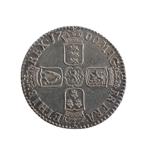 565 - A William III Shilling, dated 1700, good v/f.Provenance; The Jeffery William John Dodman Collection ... 