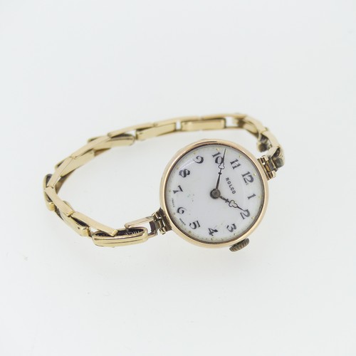 220 - A 9ct yellow gold Rolco lady's Wristwatch, with Swiss 15-jewels movement, white enamel dial with Ara... 